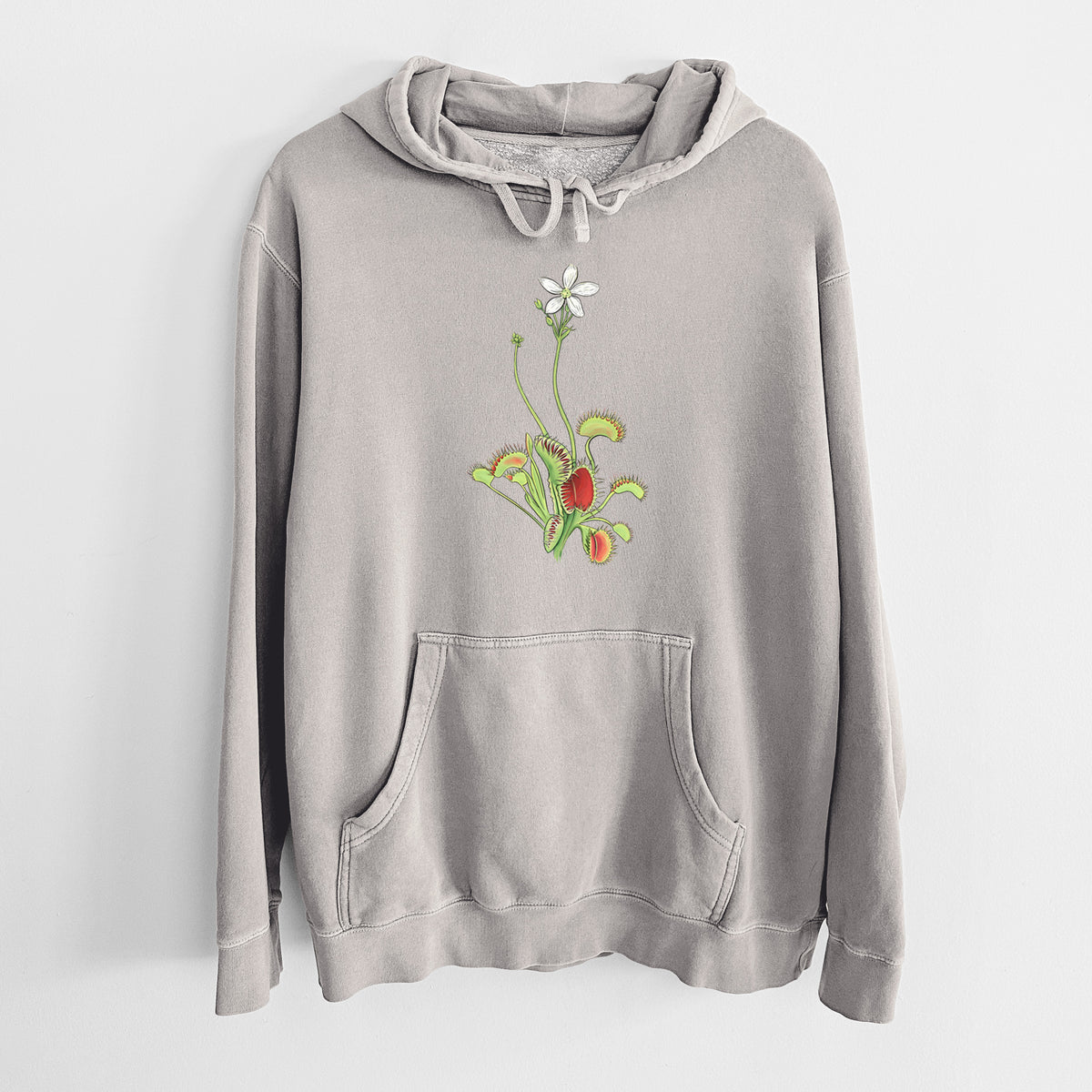 Cement grey pigment dyed hoodie laid flat, printed with a full-color illustration of a Venus flytrap plant with red traps and a small white flower.