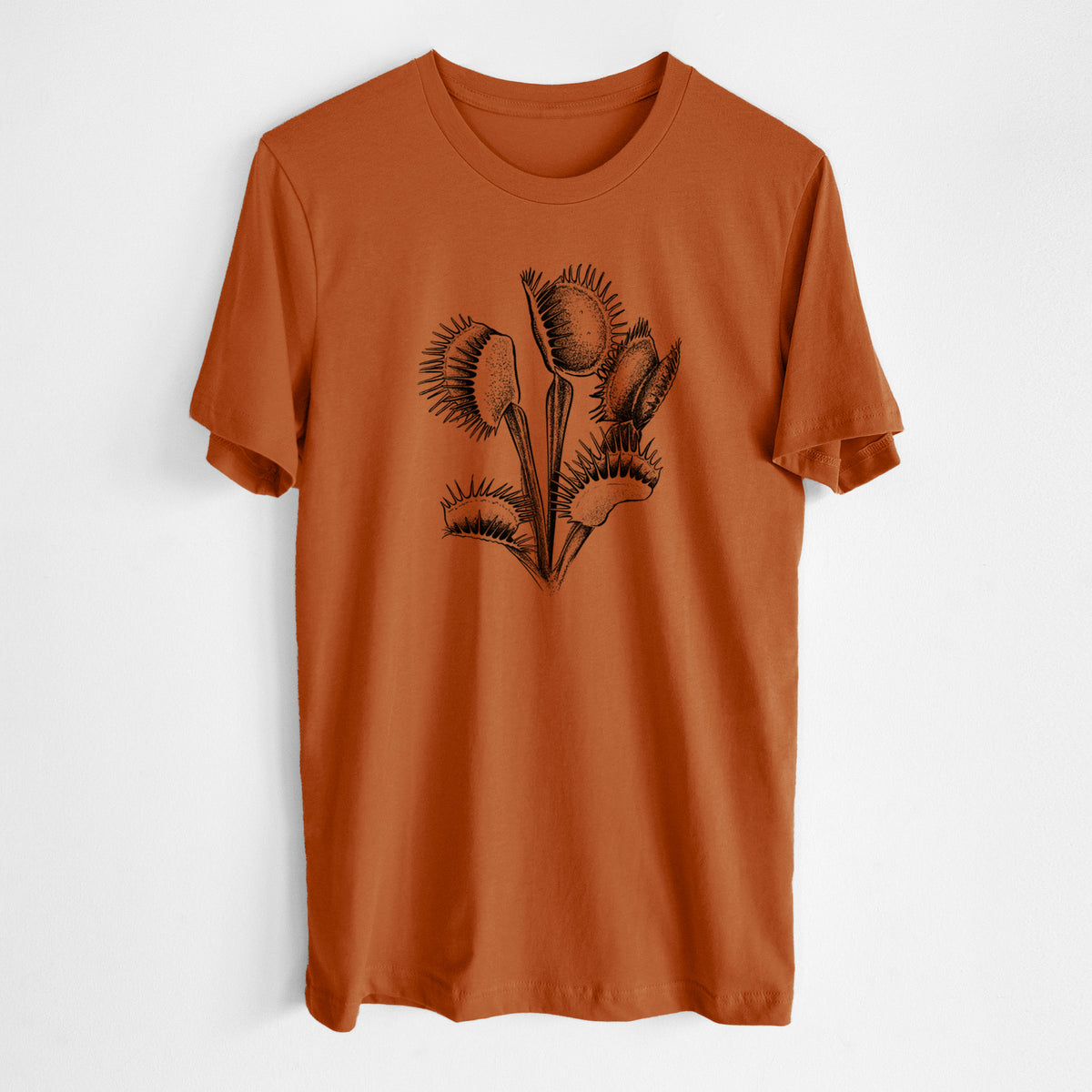Autumn lightweight cotton t-shirt laid flat, printed with a black ink illustration of a Venus flytrap plant with open traps.