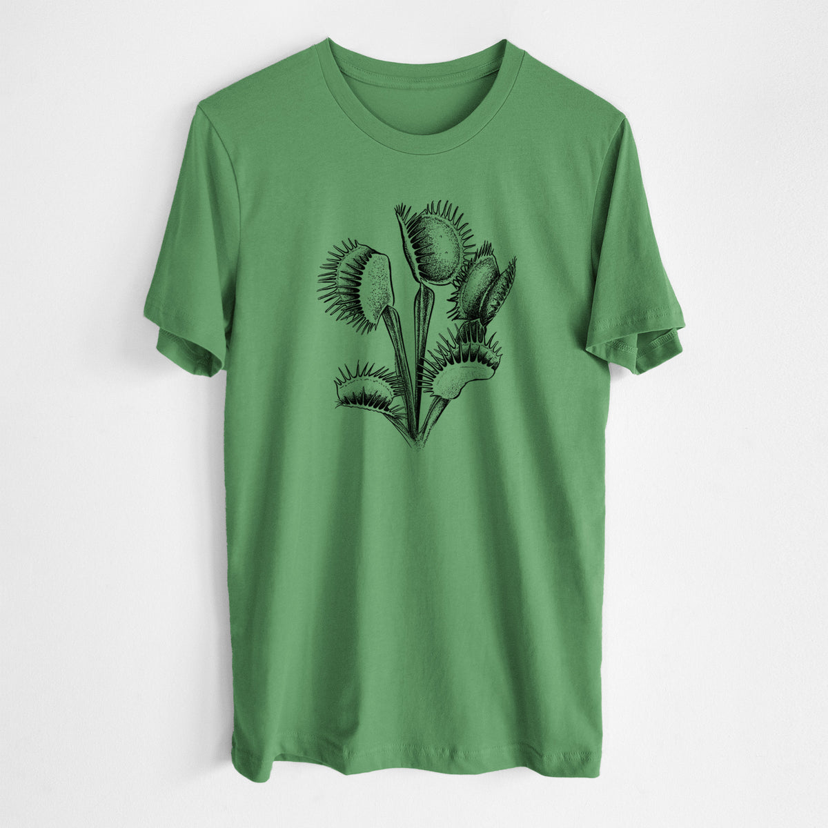 Leaf green lightweight cotton t-shirt laid flat, printed with a black ink illustration of a Venus flytrap plant with open traps.