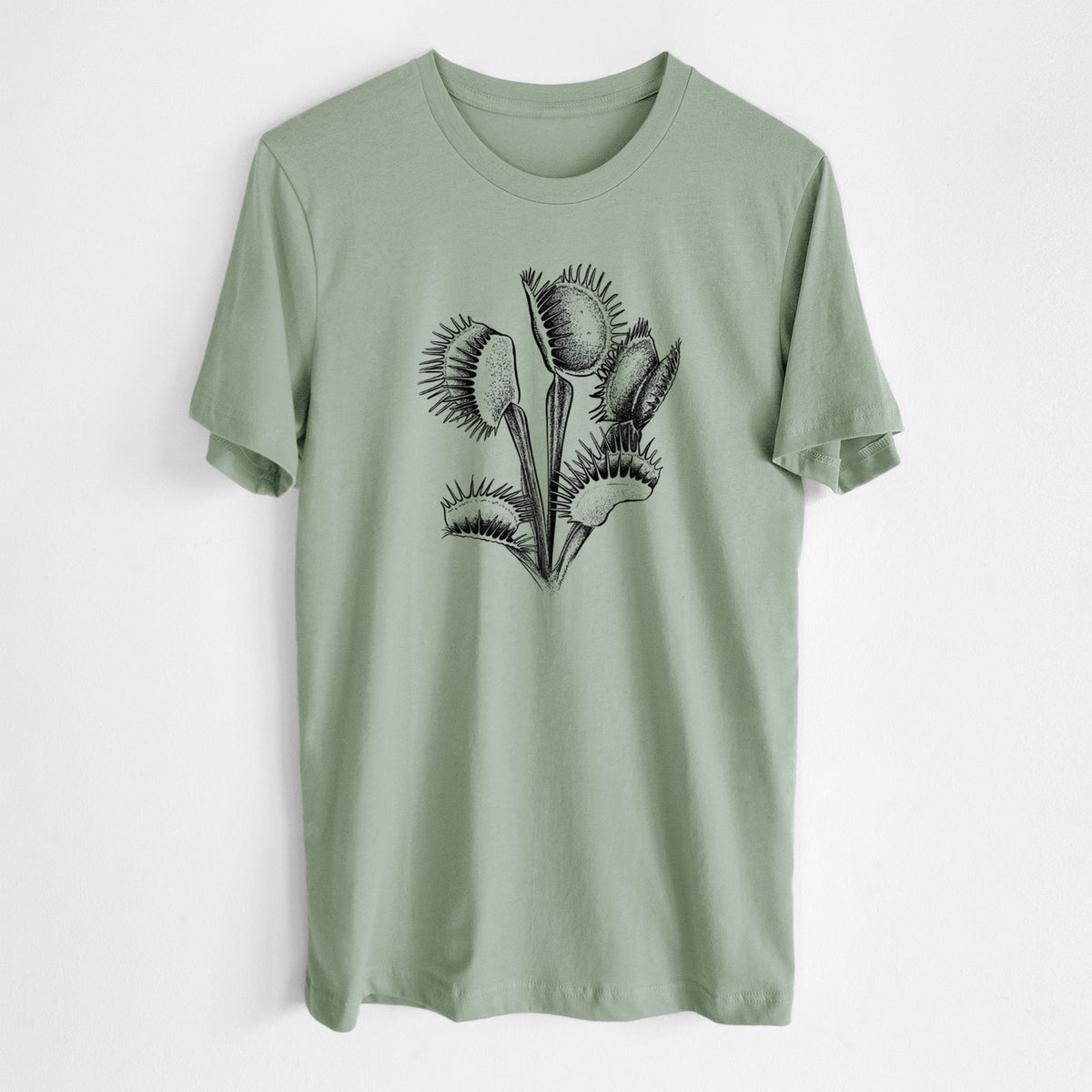 Sage green lightweight cotton t-shirt laid flat, printed with a black ink illustration of a Venus flytrap plant with open traps.