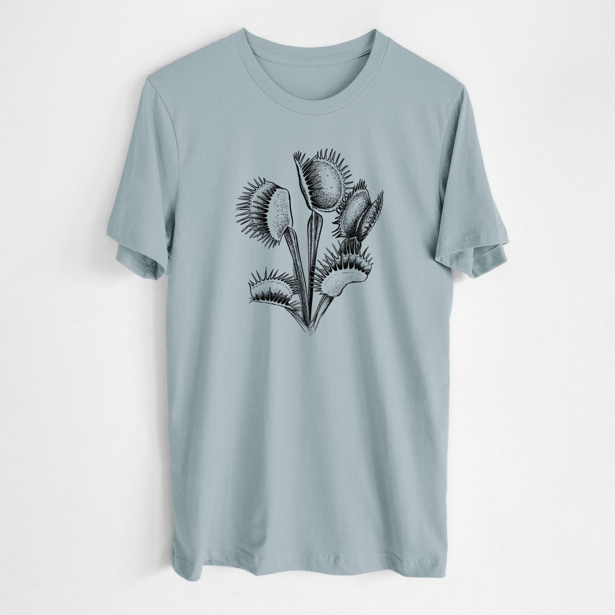 Vintage denim lightweight cotton t-shirt laid flat, printed with a black ink illustration of a Venus flytrap plant with open traps.