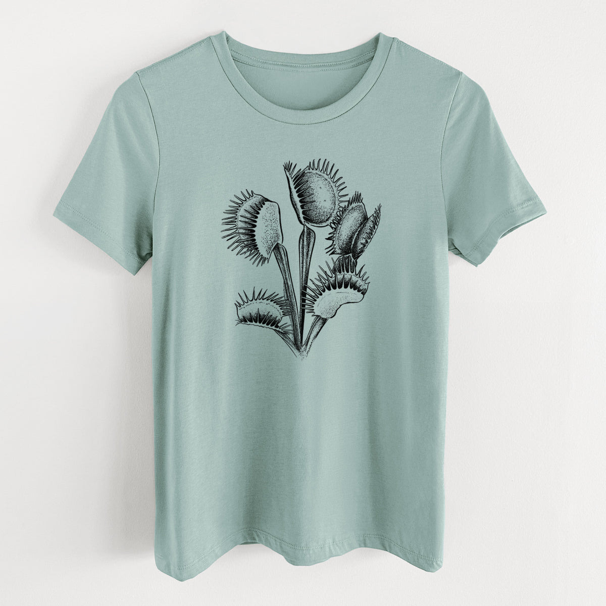 Dusty blue women's relaxed fit cotton t-shirt laid flat, printed with a black ink illustration of a Venus flytrap plant with open traps.