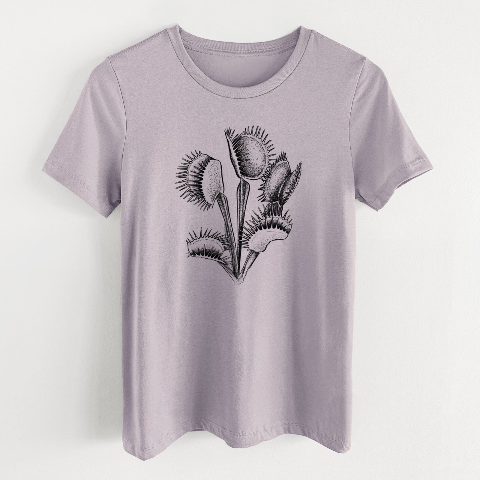 Light violet women's relaxed fit cotton t-shirt laid flat, printed with a black ink illustration of a Venus flytrap plant with open traps.