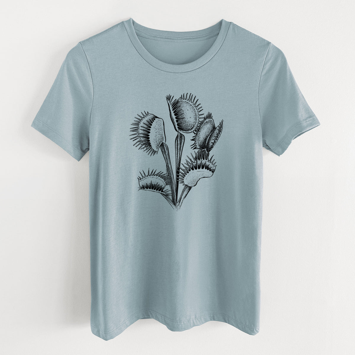 Vintage denim women's relaxed fit cotton t-shirt laid flat, printed with a black ink illustration of a Venus flytrap plant with open traps.