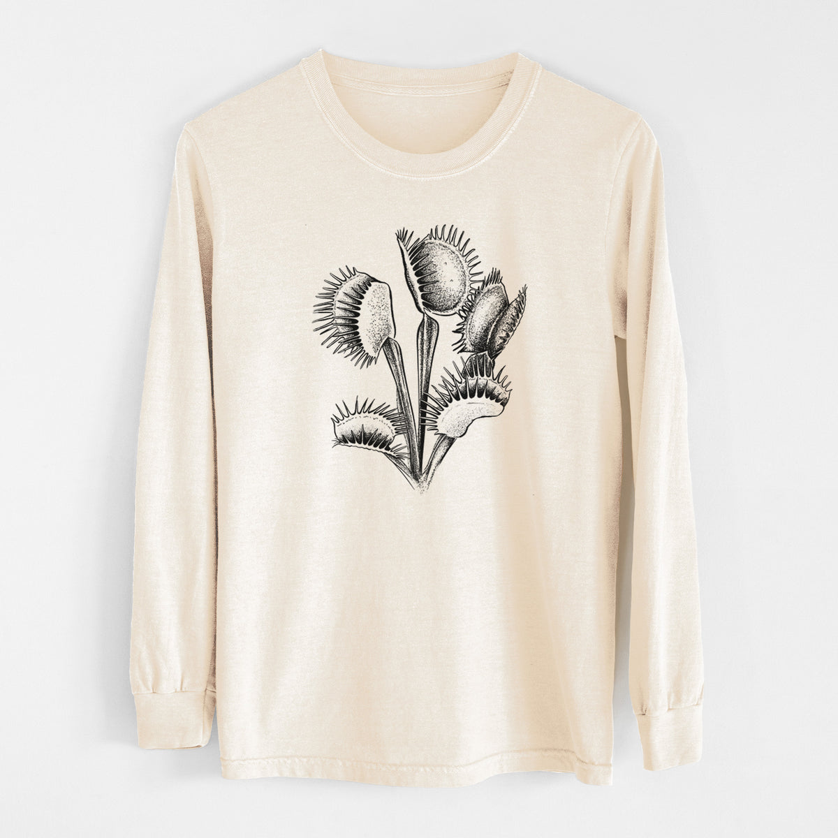 Ivory Comfort Colors long sleeve shirt laid flat, printed with a black ink illustration of a Venus flytrap plant with open traps.