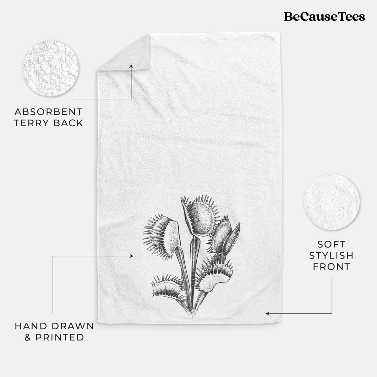 White hand towel printed with a black ink illustration of a Venus flytrap plant with open traps.