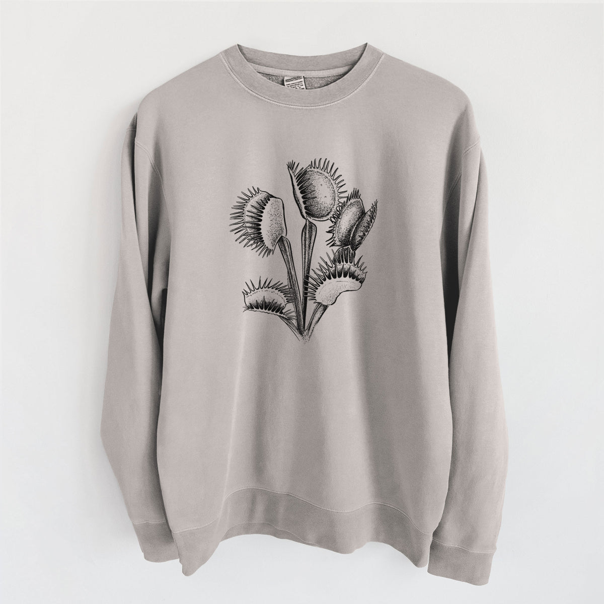 Cement grey pigment dyed crewneck sweatshirt laid flat, printed with a black ink illustration of a Venus flytrap plant with open traps.