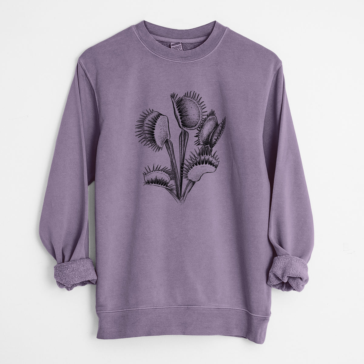 Plum purple pigment dyed crewneck sweatshirt laid flat with the sleeves rolled, printed with a black ink illustration of a Venus flytrap plant with open traps.