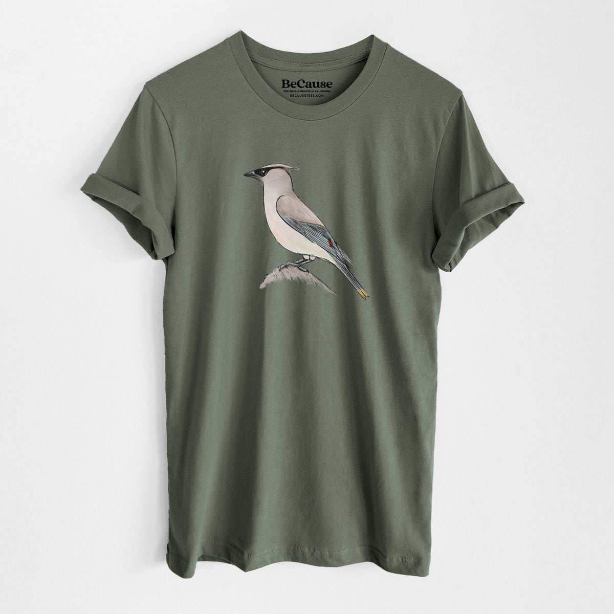 Military green lightweight cotton t-shirt laid flat, printed with a full-color illustration of a cedar waxwing perched on a branch.