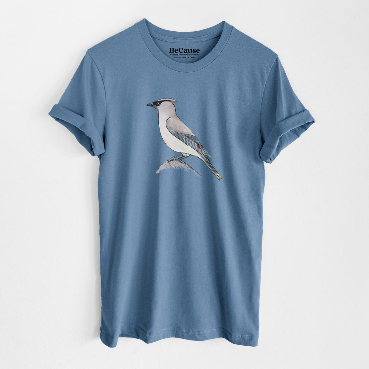 Steel blue lightweight cotton t-shirt laid flat, printed with a full-color illustration of a cedar waxwing perched on a branch.