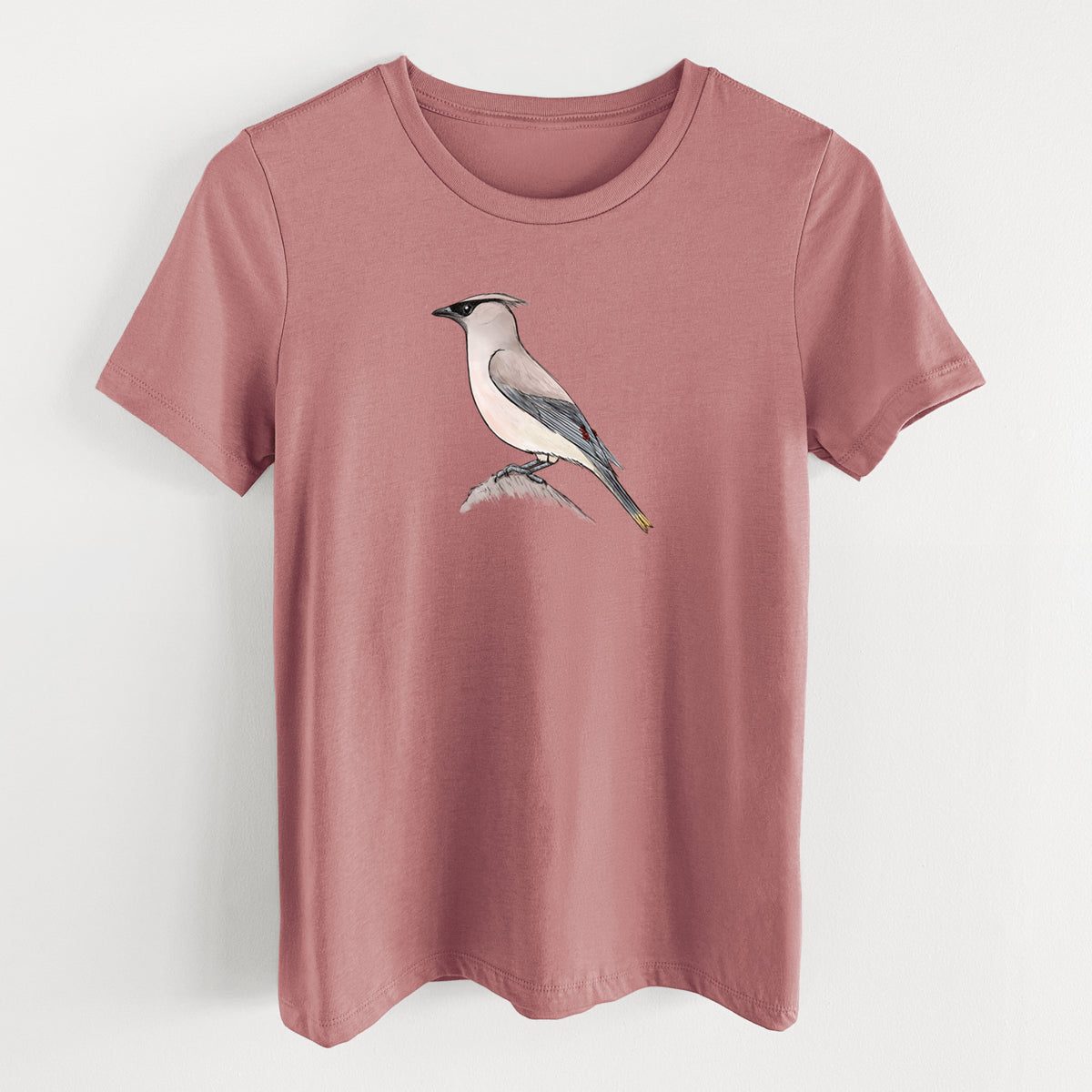 Mauve pink women's relaxed fit cotton t-shirt laid flat, printed with a full-color illustration of a cedar waxwing perched on a branch.