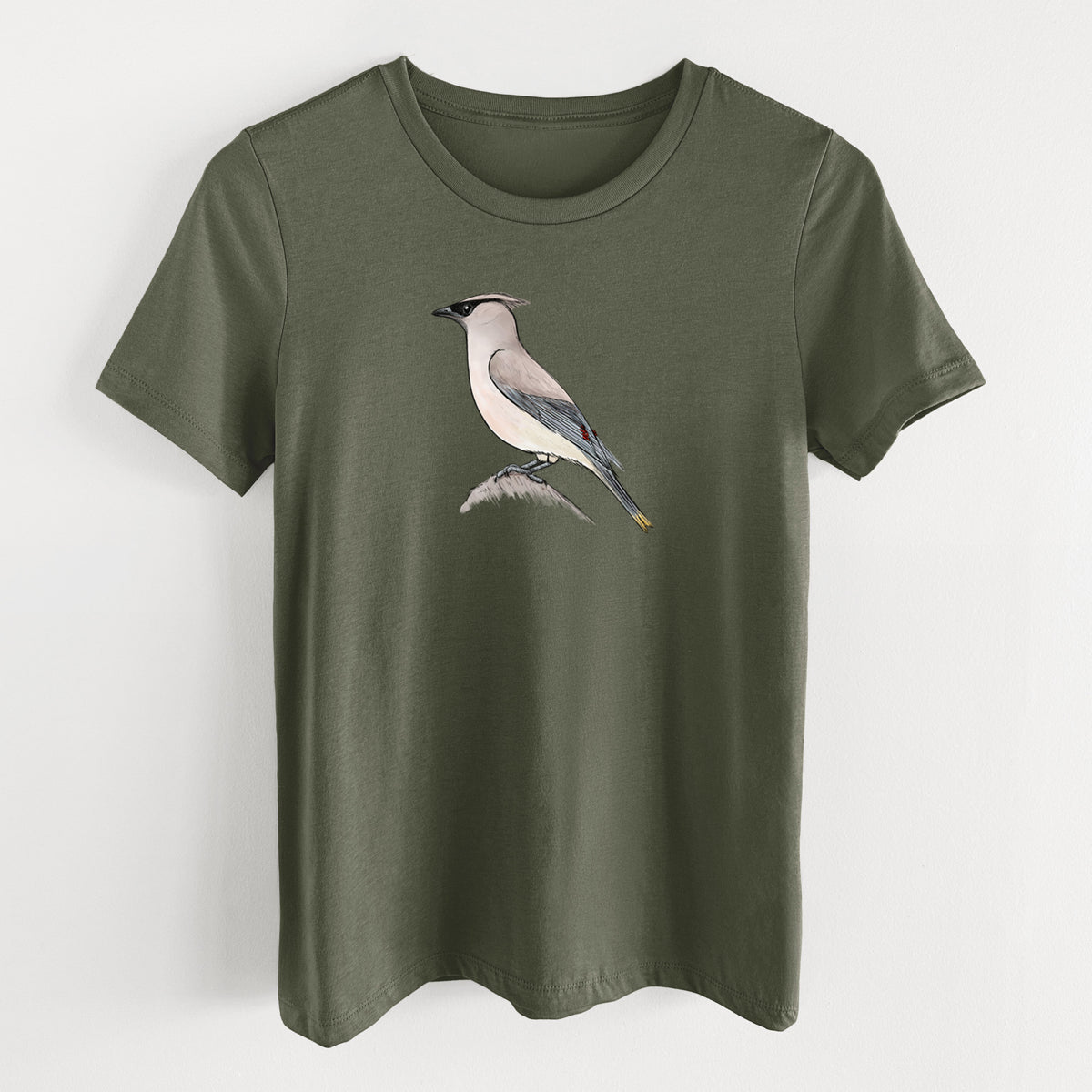Military green women's relaxed fit cotton t-shirt laid flat, printed with a full-color illustration of a cedar waxwing perched on a branch.
