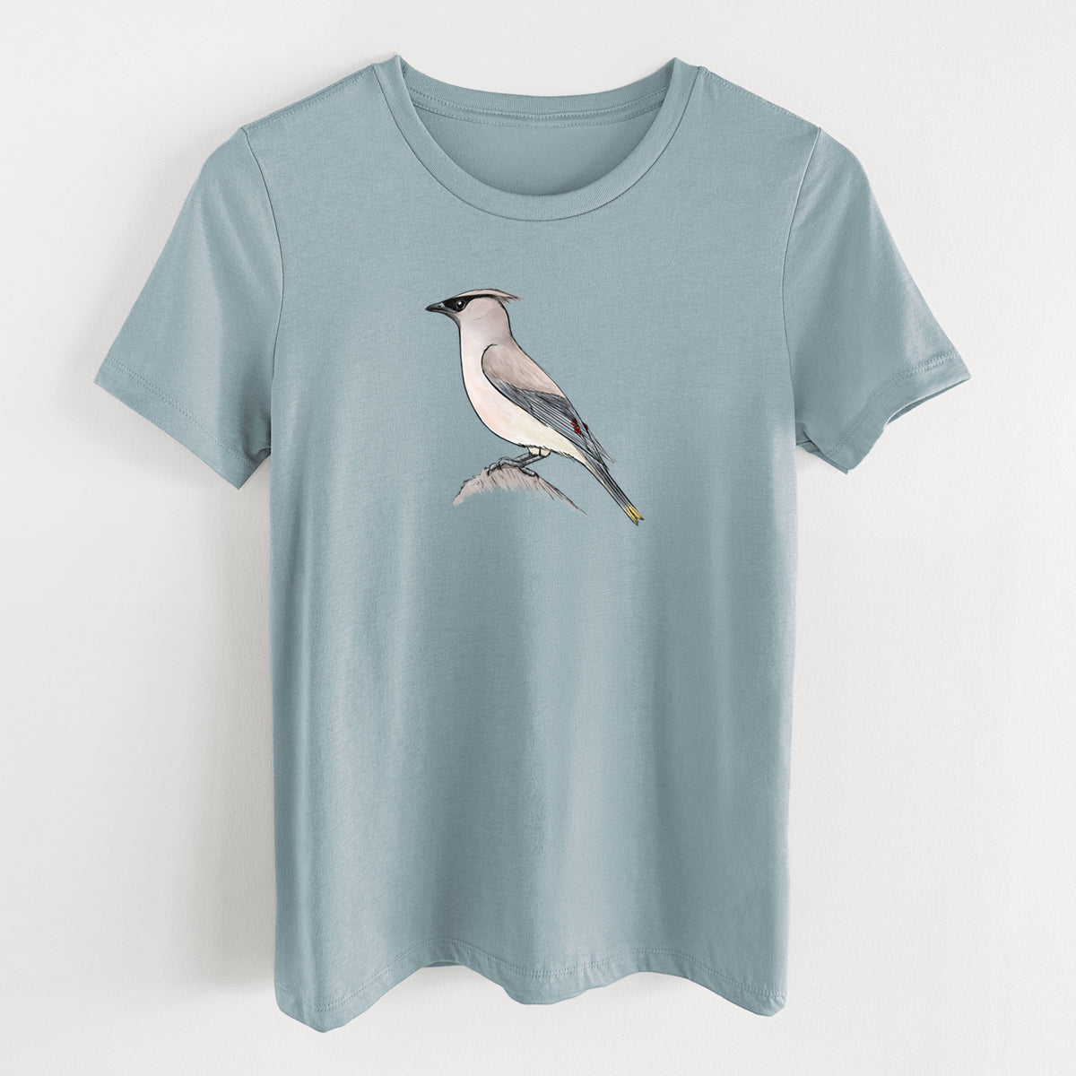 Vintage denim women's relaxed fit cotton t-shirt laid flat, printed with a full-color illustration of a cedar waxwing perched on a branch.