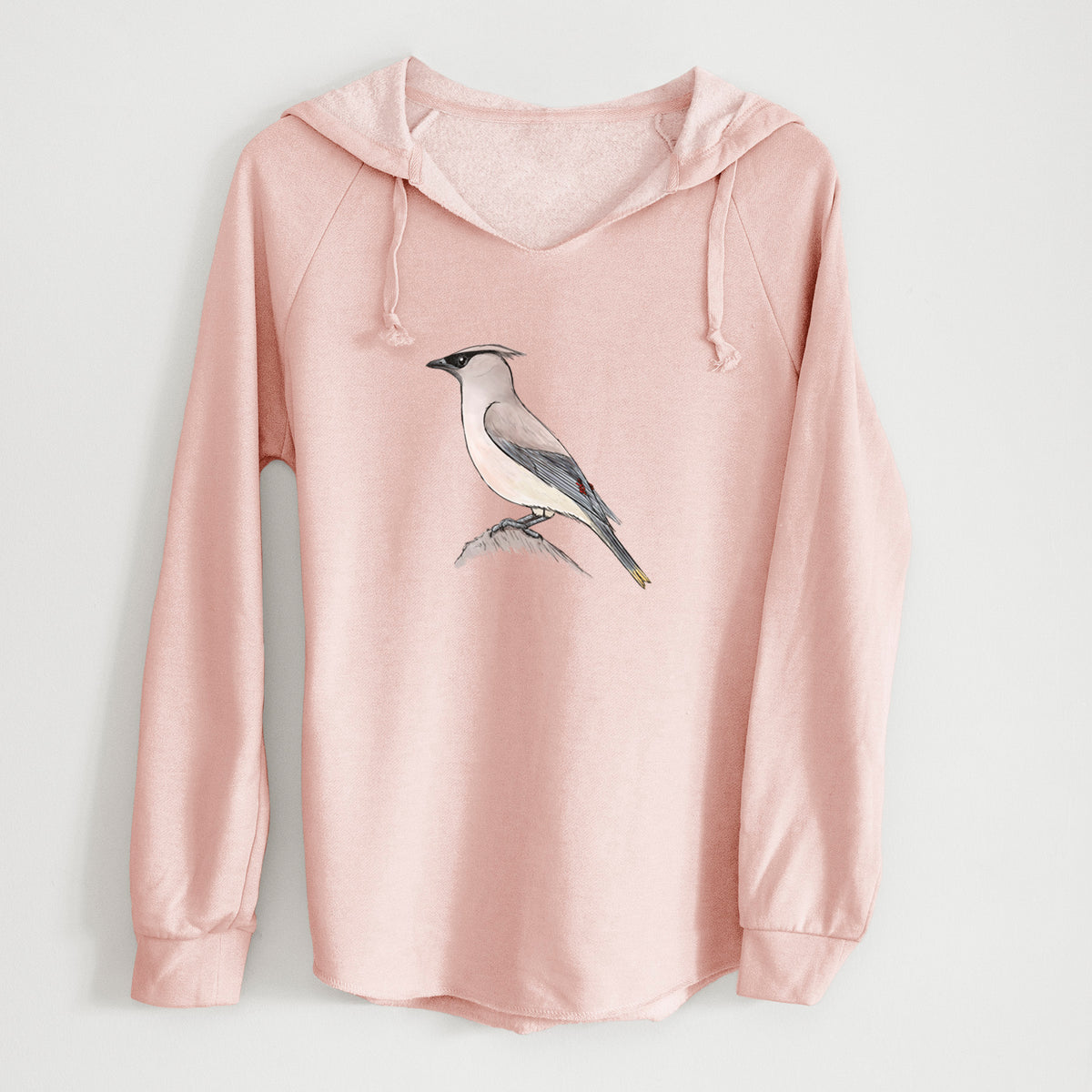 Blush pink women's Cali Wave hooded sweatshirt laid flat, printed with a full-color illustration of a cedar waxwing perched on a branch.