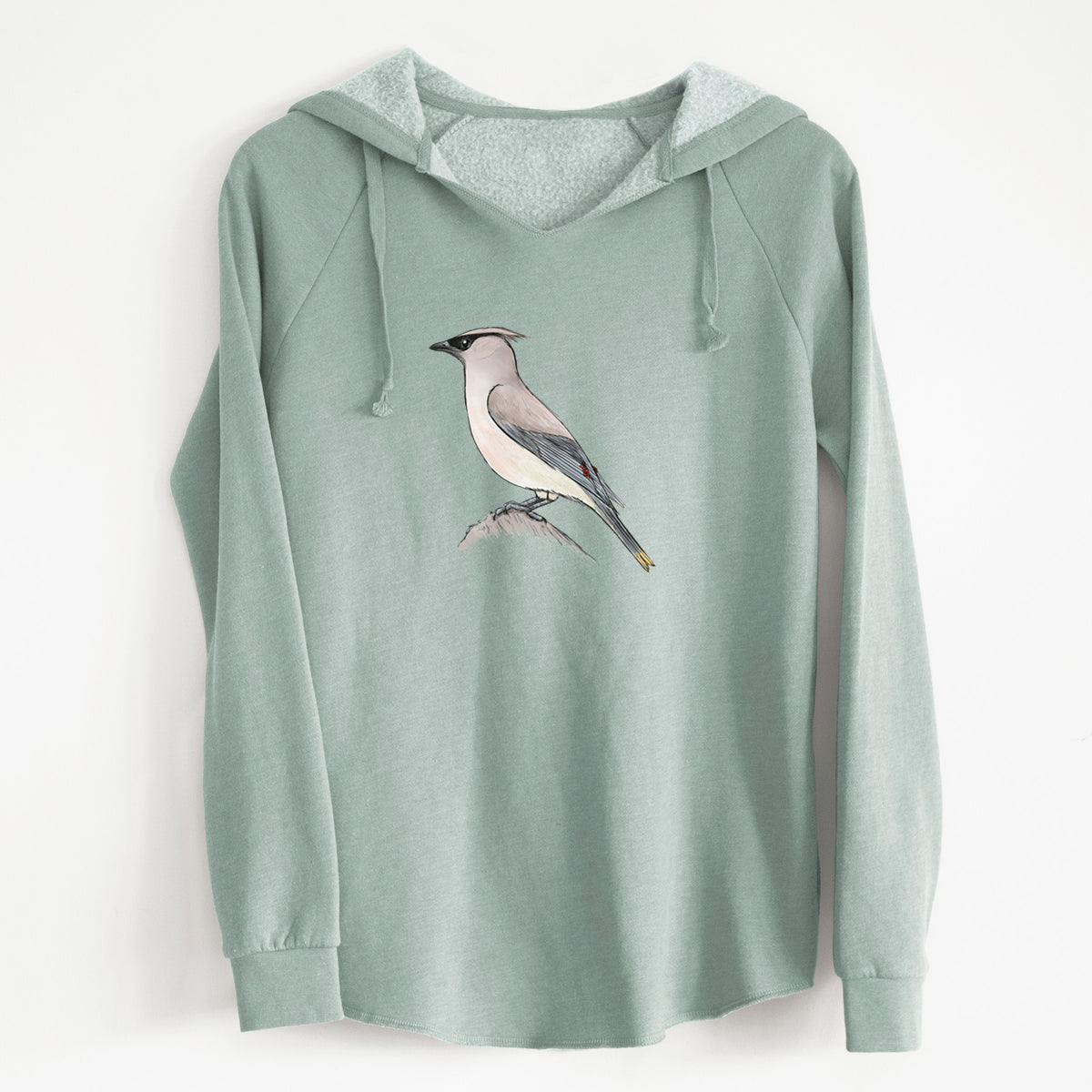 Sage green women's Cali Wave hooded sweatshirt laid flat, printed with a full-color illustration of a cedar waxwing perched on a branch.