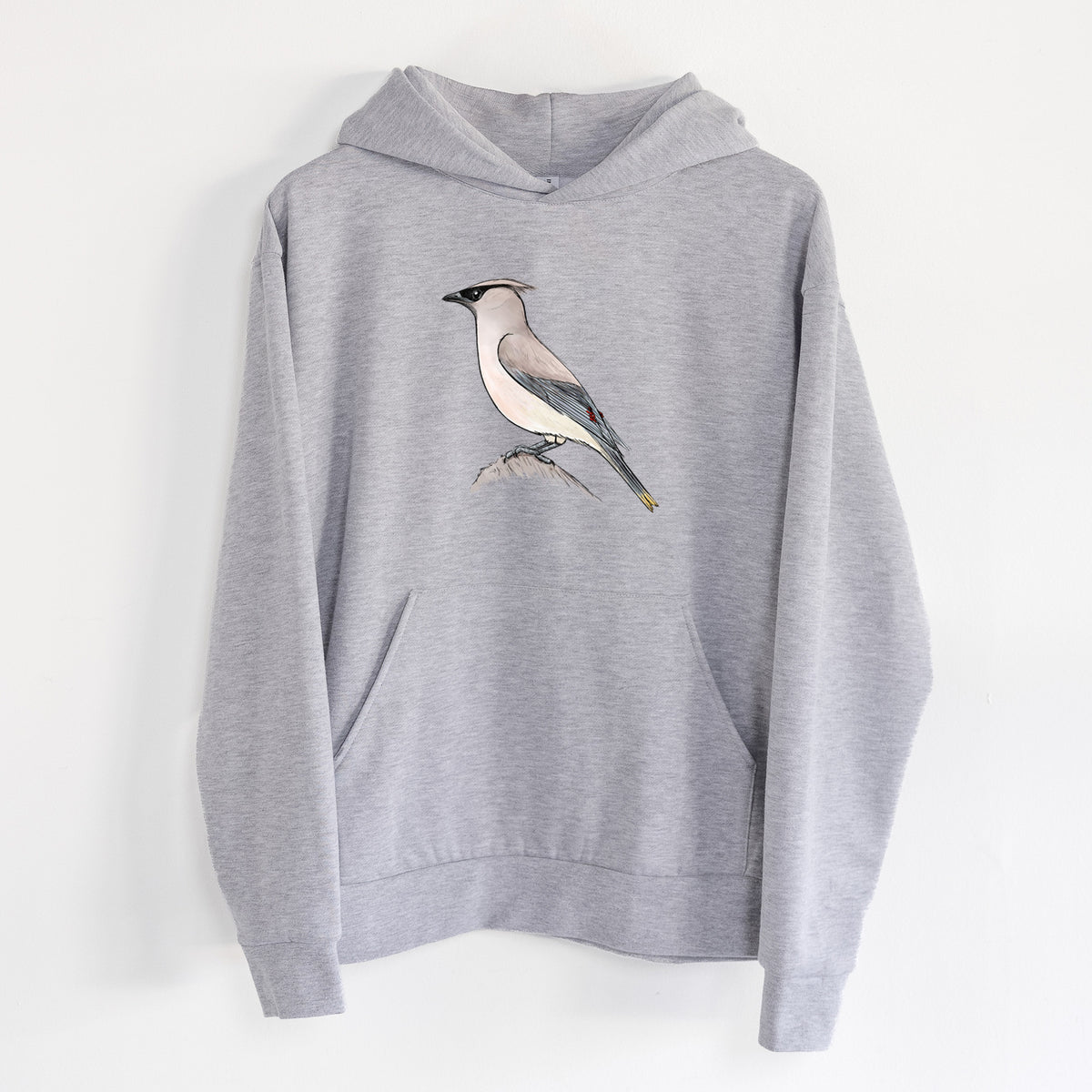 Vibrant Cedar Waxwing - Bombycilla cedrorum - Statement Midweight Hoodie in Heather Grey, hanging on a white wall, with a front kangaroo pocket and no drawcords.