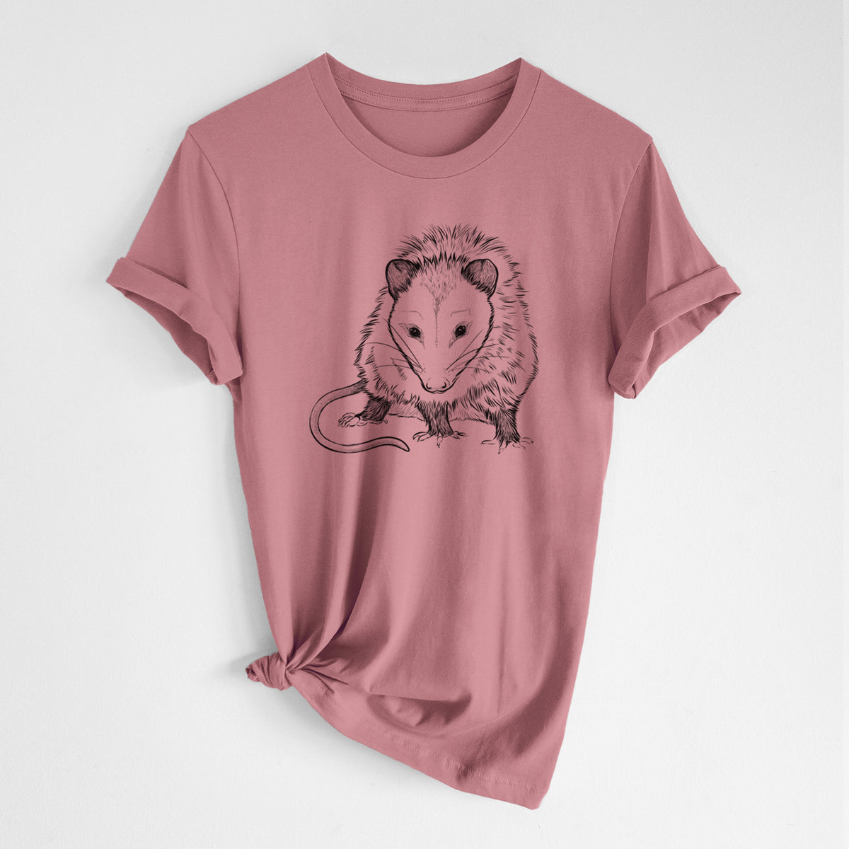 Mauve pink lightweight cotton t-shirt laid flat with the sleeves rolled, printed with a detailed black ink illustration of a Virginia opossum standing with its long tail curled.