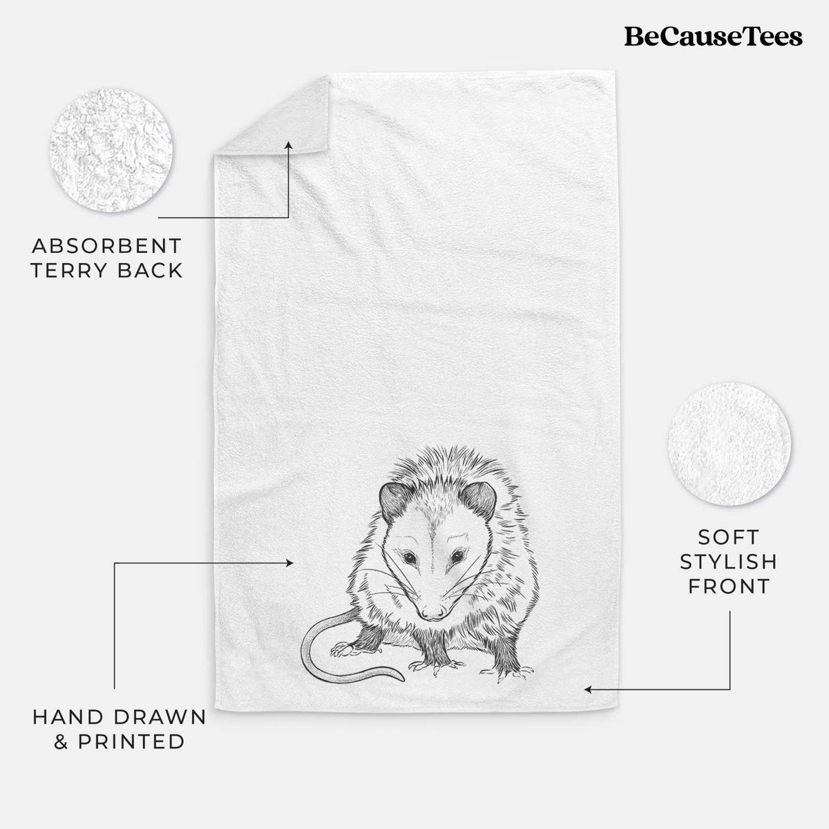 White hand towel printed with a detailed black ink illustration of a Virginia opossum standing with its long tail curled.