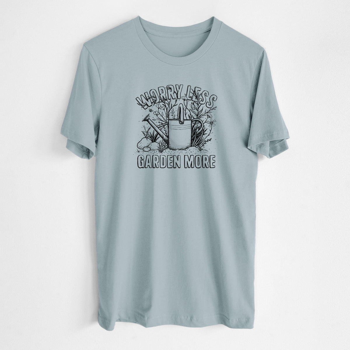 Vintage denim lightweight cotton t-shirt laid flat, printed with a black ink watering can surrounded by flowers and garden tools, with the words Worry Less, Garden More.