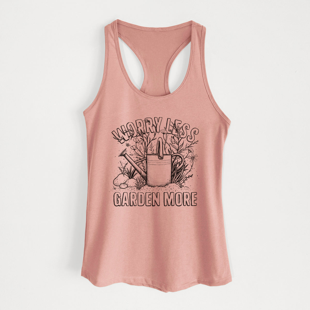 Desert pink women's racerback tank top laid flat, printed with a black ink watering can surrounded by flowers and garden tools, with the words Worry Less, Garden More.
