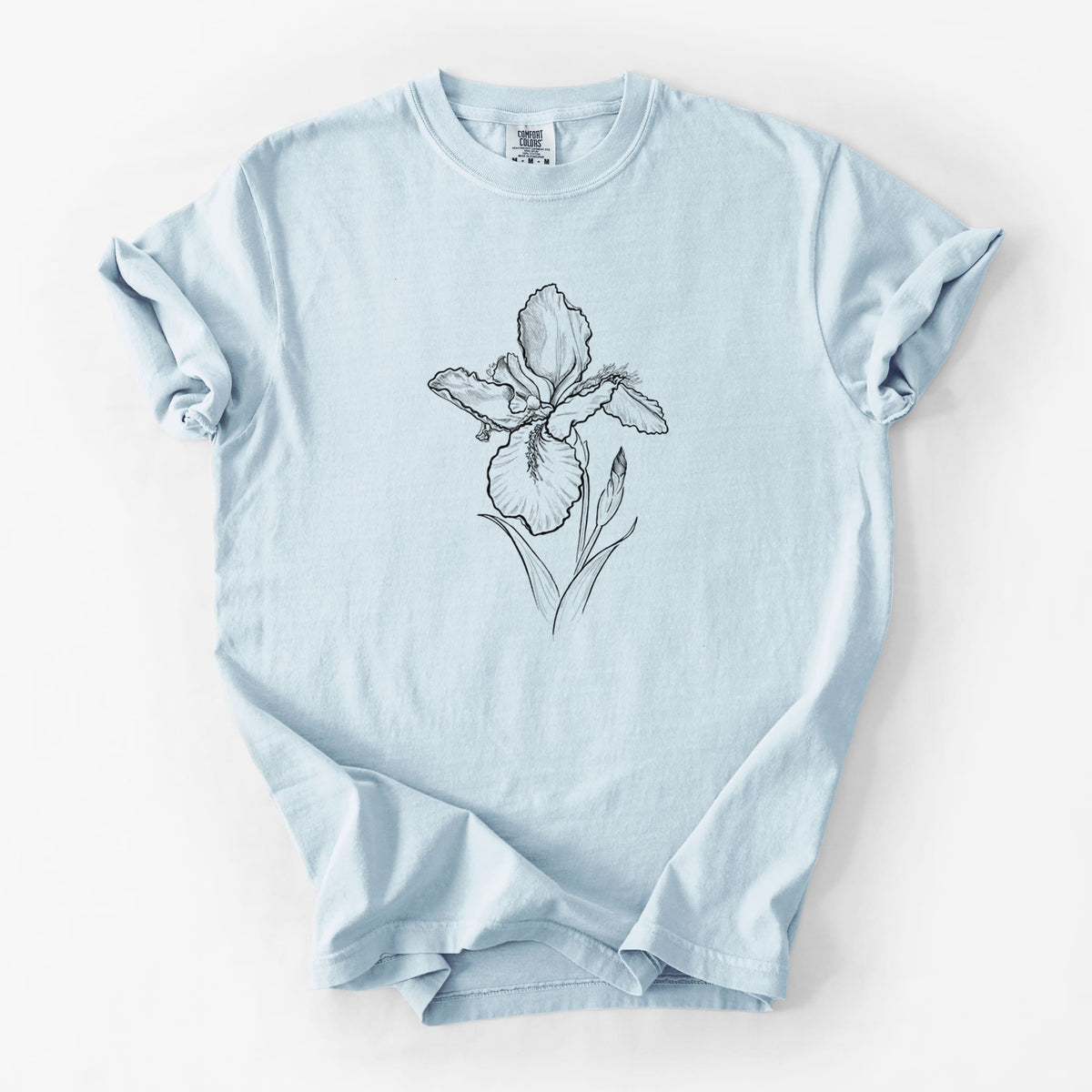 Chambray blue Comfort Colors t-shirt laid flat, printed with a black ink line drawing of a wall iris flower on its stem.