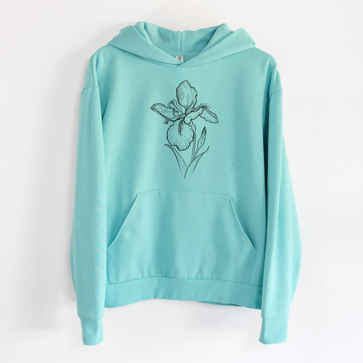 Wall Iris - Iris tectorum - Statement Midweight Hoodie in Seafoam, hanging on a white wall, with a front kangaroo pocket and no drawcords.