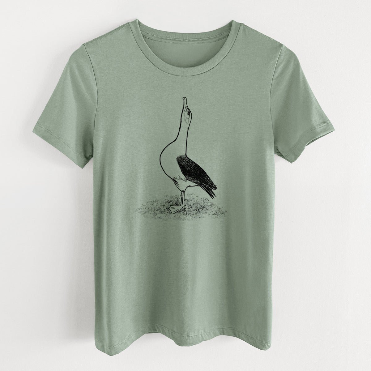 Sage green women's relaxed fit cotton t-shirt laid flat, printed with a black ink illustration of a wandering albatross with its head raised.