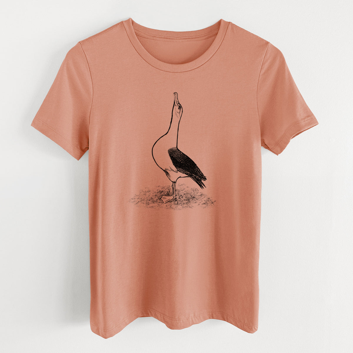 Terracotta orange women's relaxed fit cotton t-shirt laid flat, printed with a black ink illustration of a wandering albatross with its head raised.