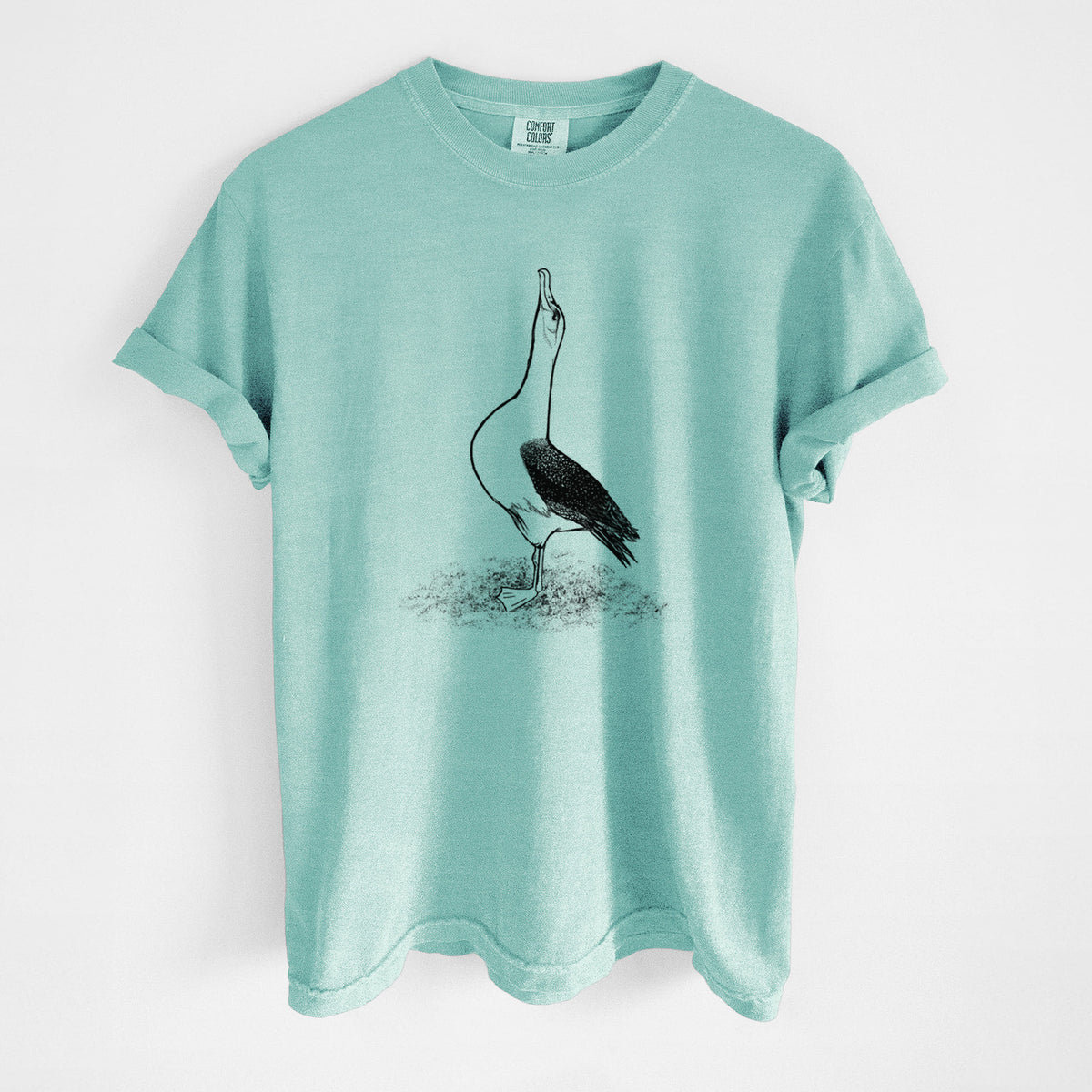 Chalky mint Comfort Colors t-shirt laid flat, printed with a black ink illustration of a wandering albatross with its head raised.