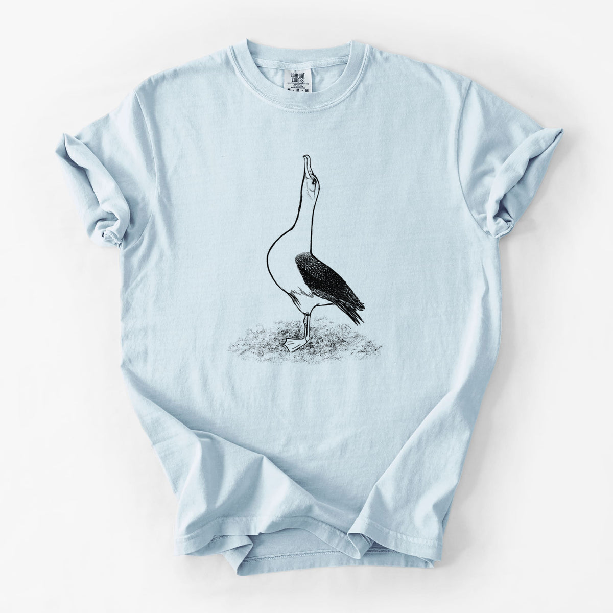 Chambray blue Comfort Colors t-shirt laid flat, printed with a black ink illustration of a wandering albatross with its head raised.