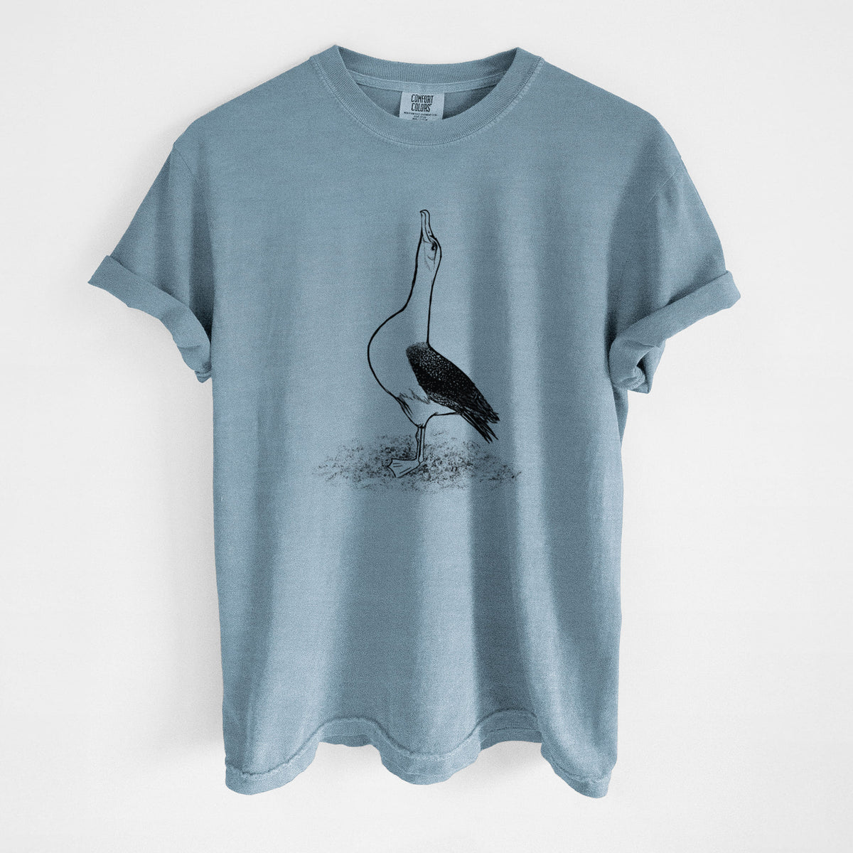 Steel blue Comfort Colors t-shirt laid flat, printed with a black ink illustration of a wandering albatross with its head raised.