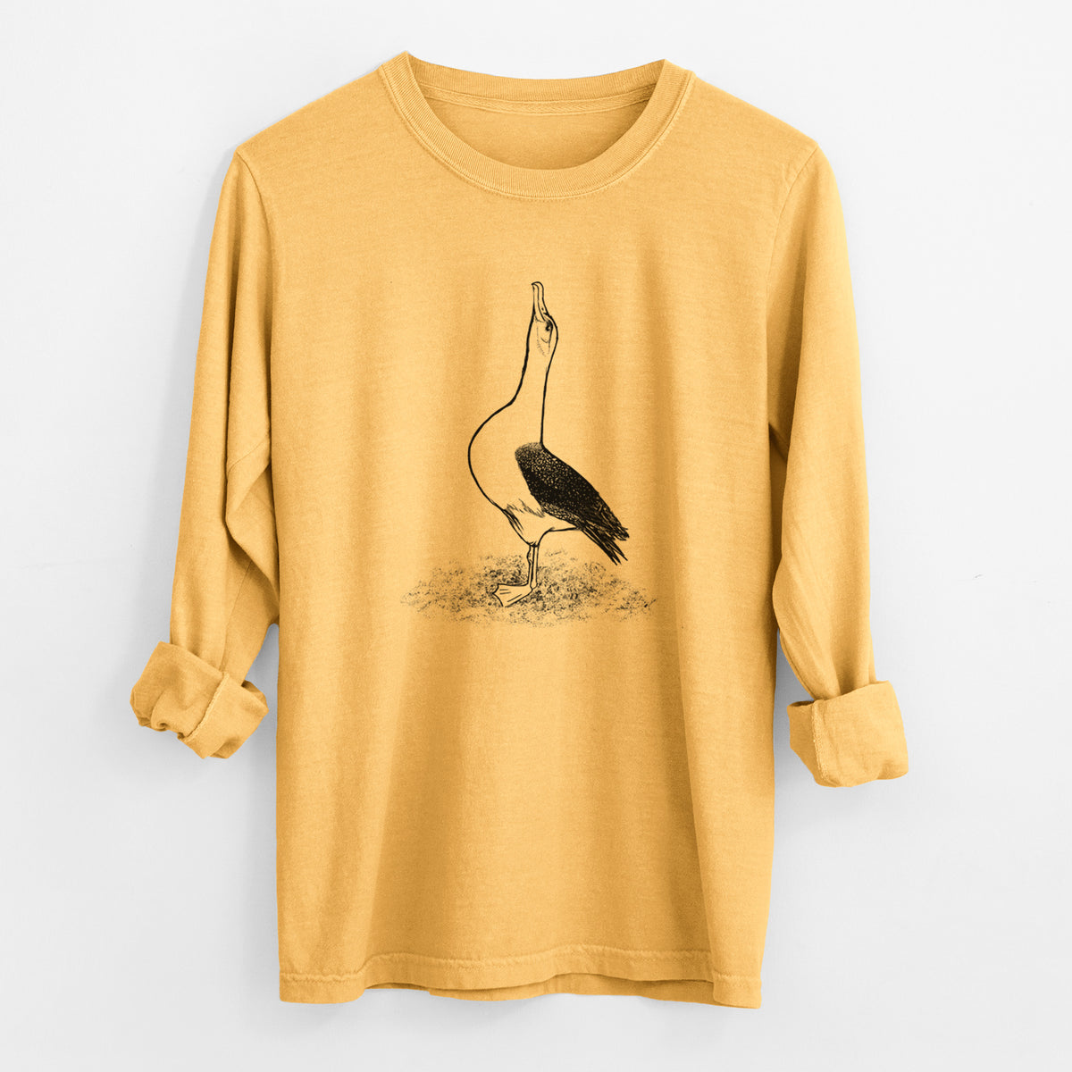 Golden wheat yellow Comfort Colors long sleeve shirt laid flat with the cuffs rolled, printed with a black ink illustration of a wandering albatross with its head raised.