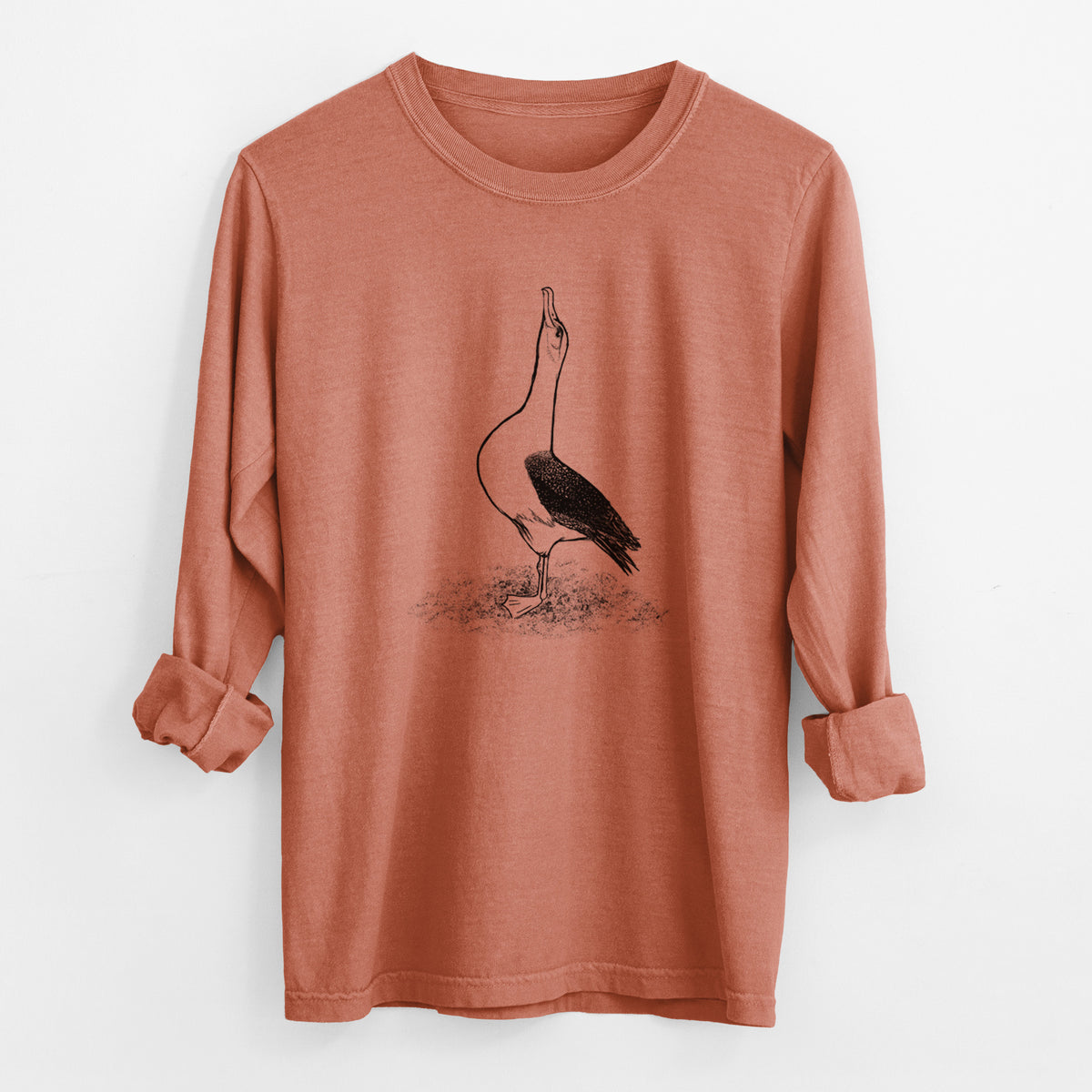 Yam burnt orange Comfort Colors long sleeve shirt laid flat with the cuffs rolled, printed with a black ink illustration of a wandering albatross with its head raised.