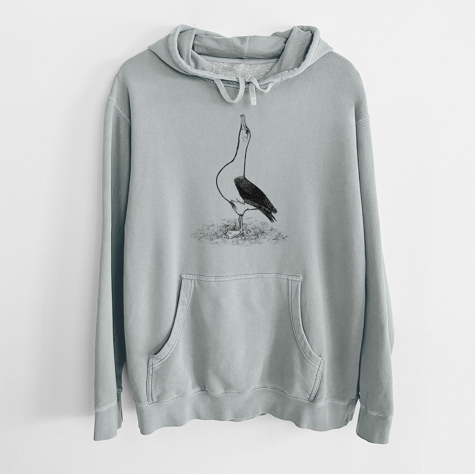 Sage green pigment dyed hoodie laid flat, printed with a black ink illustration of a wandering albatross with its head raised.