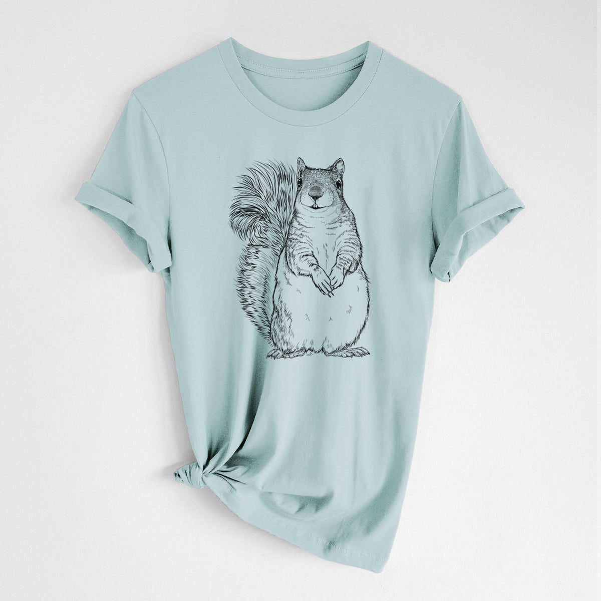 Dusty blue lightweight cotton t-shirt laid flat with the sleeves rolled, printed with a detailed black ink illustration of a western grey squirrel sitting upright with a bushy tail.