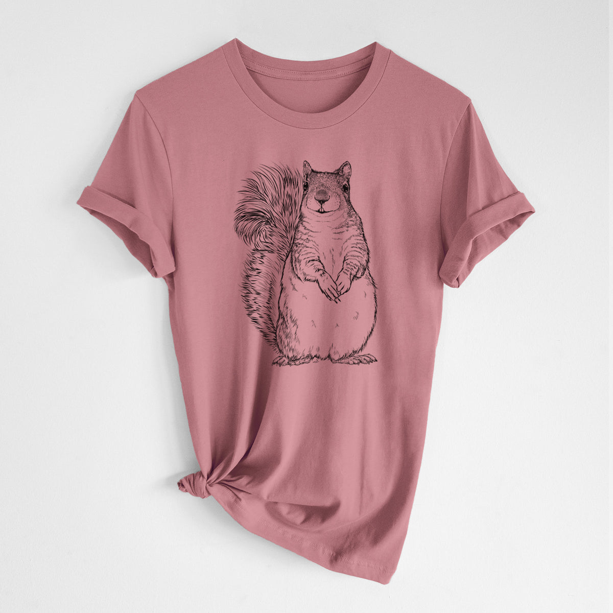 Mauve pink lightweight cotton t-shirt laid flat with the sleeves rolled, printed with a detailed black ink illustration of a western grey squirrel sitting upright with a bushy tail.