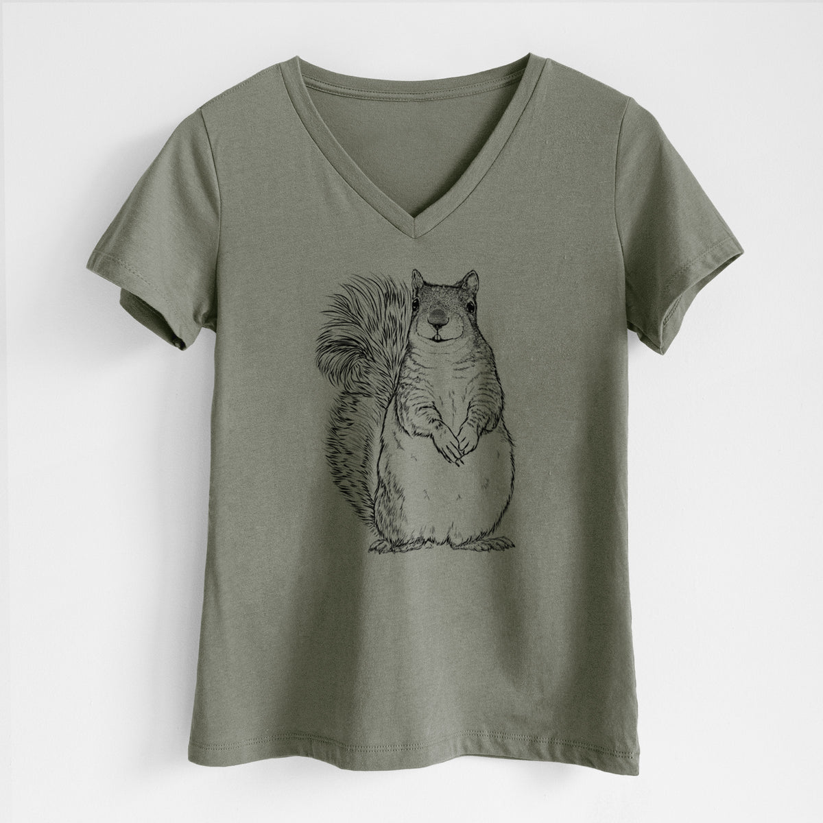 Military green women's relaxed fit cotton V-neck t-shirt laid flat, printed with a detailed black ink illustration of a western grey squirrel sitting upright with a bushy tail.
