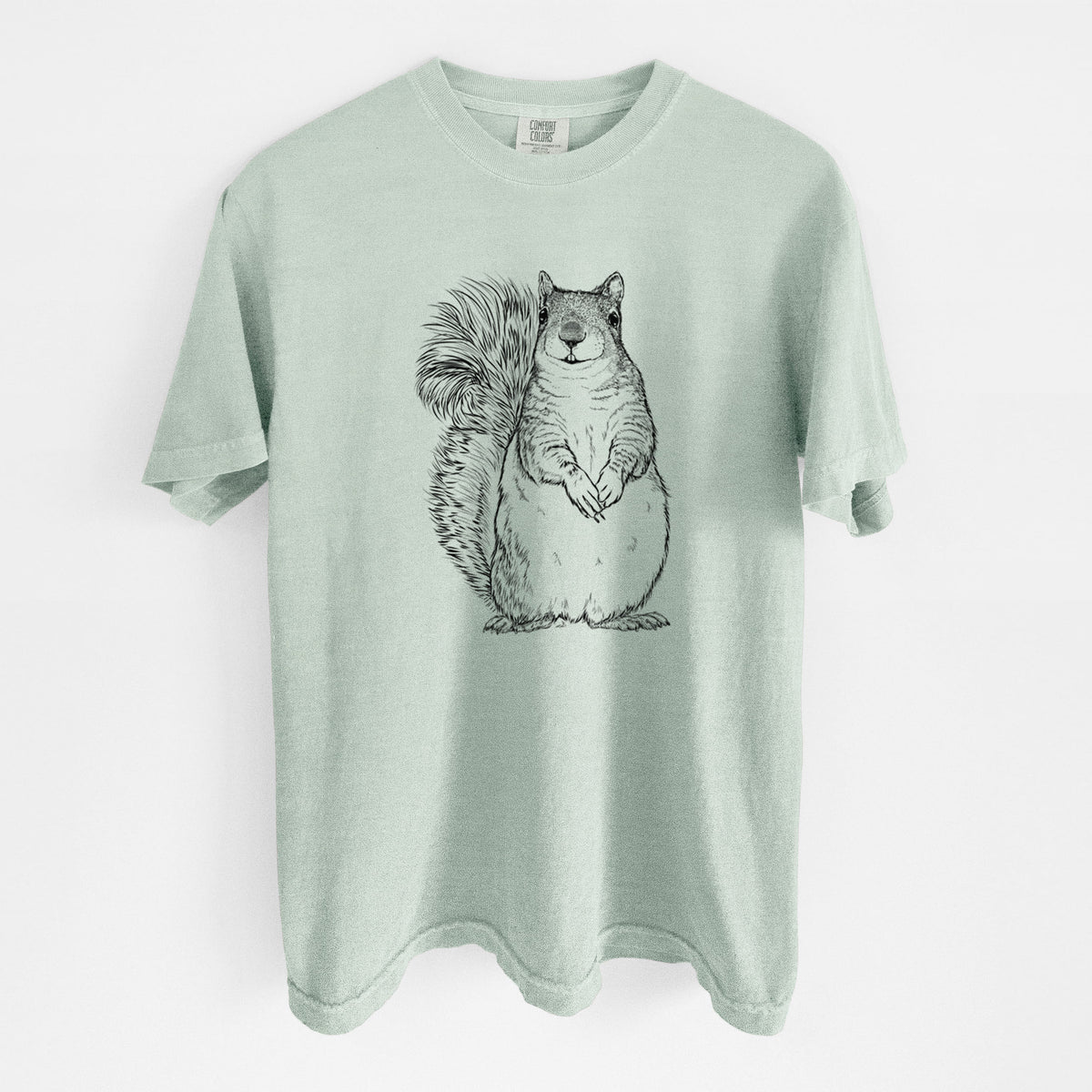 Bay green Comfort Colors t-shirt laid flat, printed with a detailed black ink illustration of a western grey squirrel sitting upright with a bushy tail.