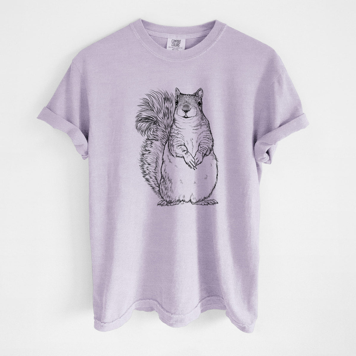 Orchid purple Comfort Colors t-shirt laid flat, printed with a detailed black ink illustration of a western grey squirrel sitting upright with a bushy tail.