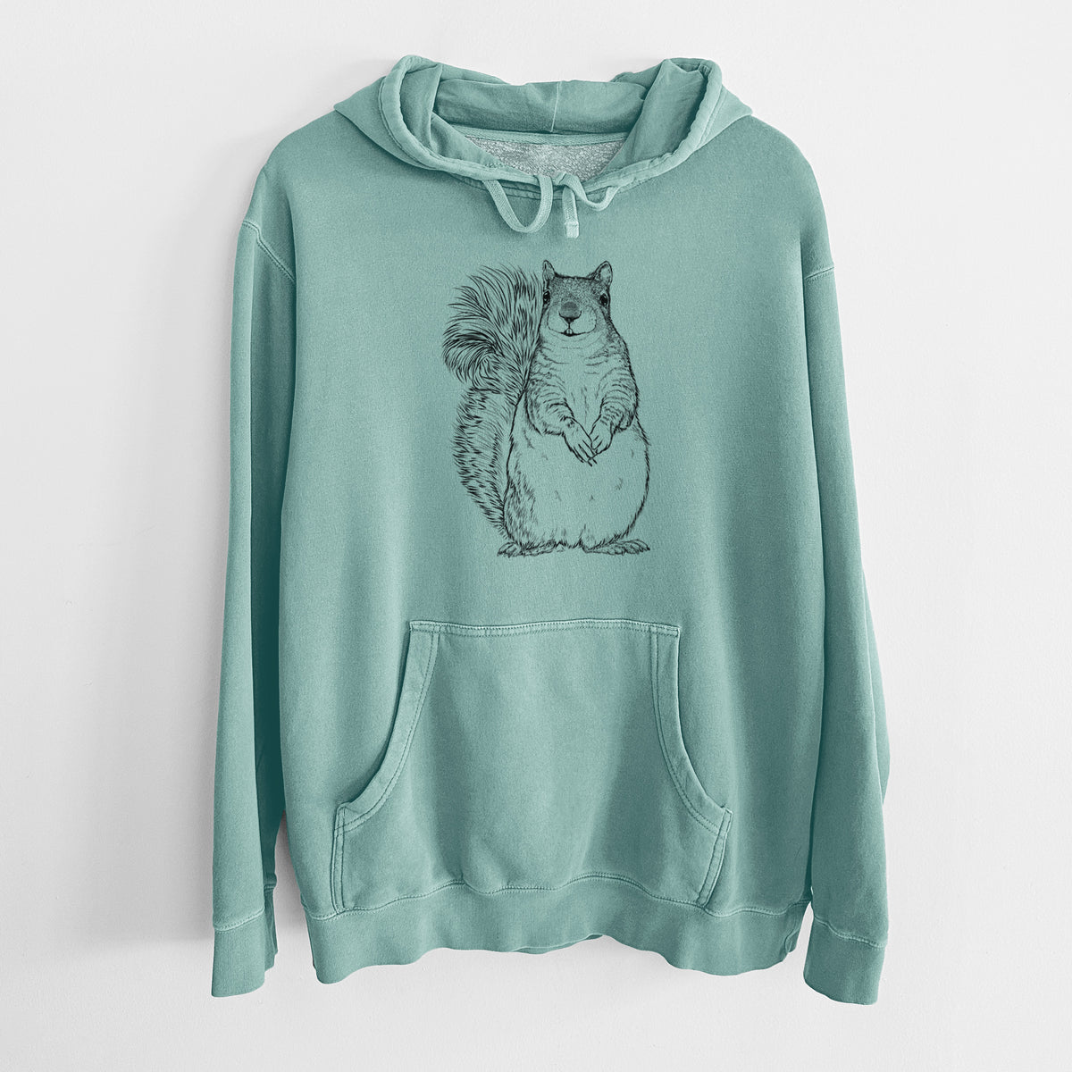 Mint green pigment dyed hoodie laid flat, printed with a detailed black ink illustration of a western grey squirrel sitting upright with a bushy tail.