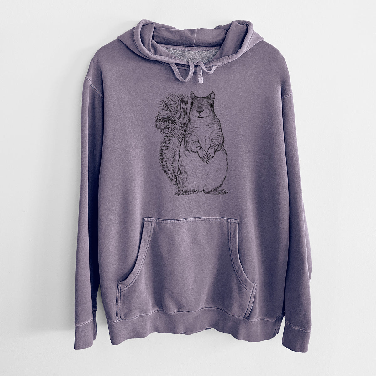 Plum purple pigment dyed hoodie laid flat, printed with a detailed black ink illustration of a western grey squirrel sitting upright with a bushy tail.
