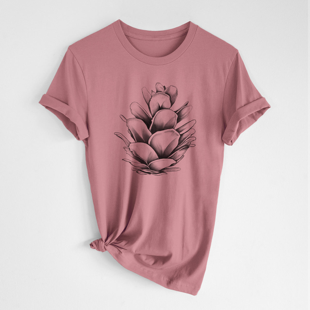 Mauve pink lightweight cotton t-shirt laid flat with the sleeves rolled, printed with a detailed black ink illustration of a western hemlock pine cone.