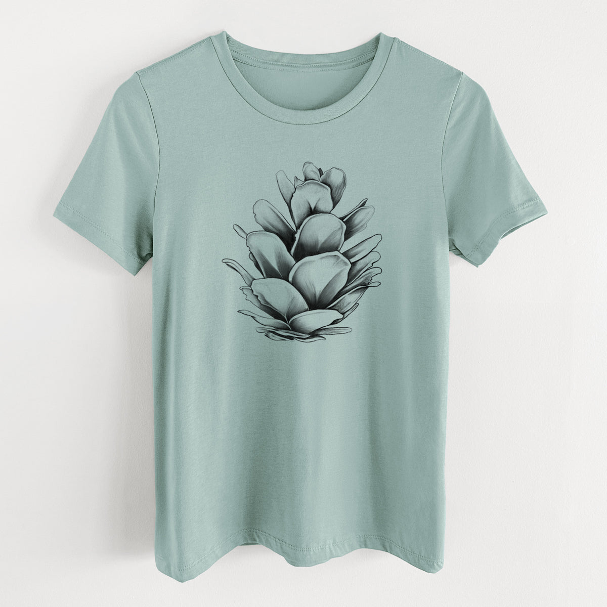 Dusty blue women's relaxed fit cotton t-shirt laid flat, printed with a detailed black ink illustration of a western hemlock pine cone.