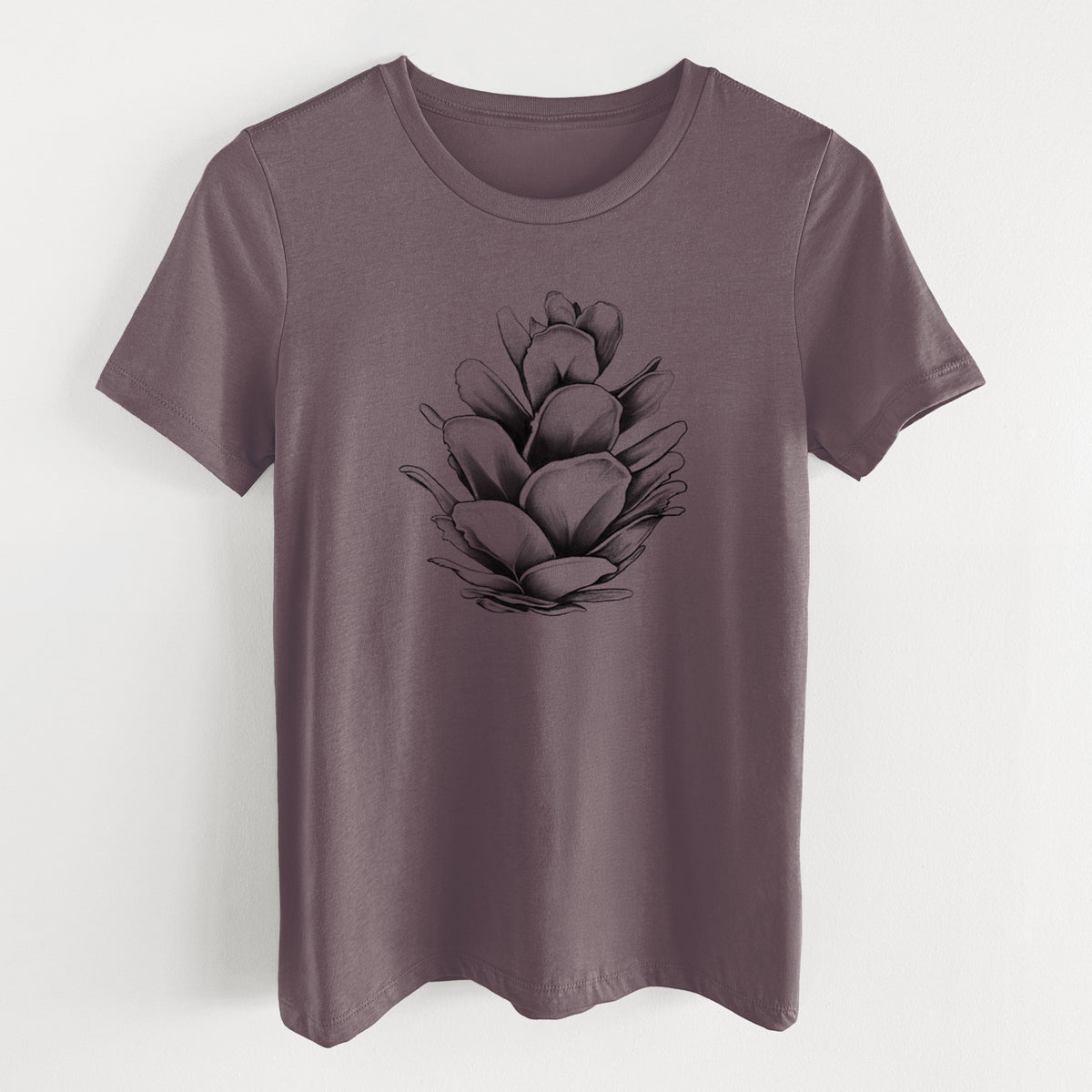 Purple storm women's relaxed fit cotton t-shirt laid flat, printed with a detailed black ink illustration of a western hemlock pine cone.