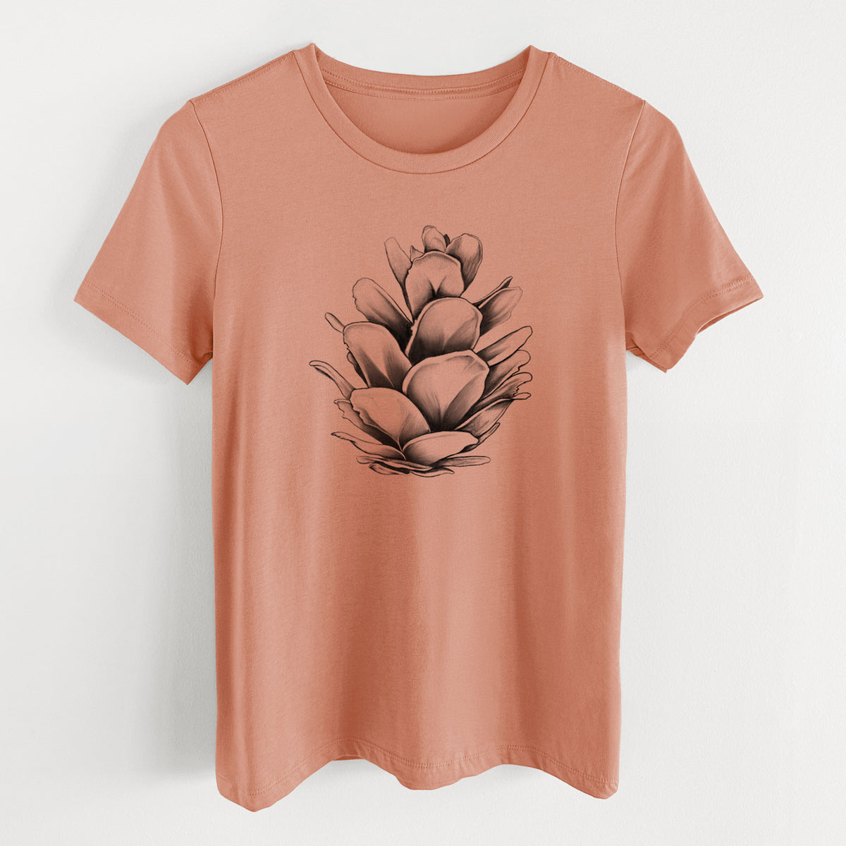 Terracotta orange women's relaxed fit cotton t-shirt laid flat, printed with a detailed black ink illustration of a western hemlock pine cone.