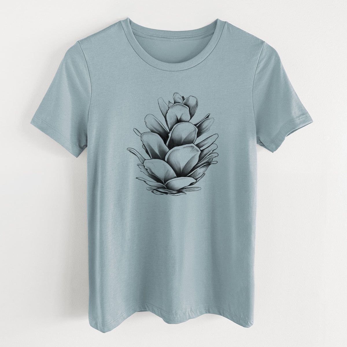Vintage denim women's relaxed fit cotton t-shirt laid flat, printed with a detailed black ink illustration of a western hemlock pine cone.
