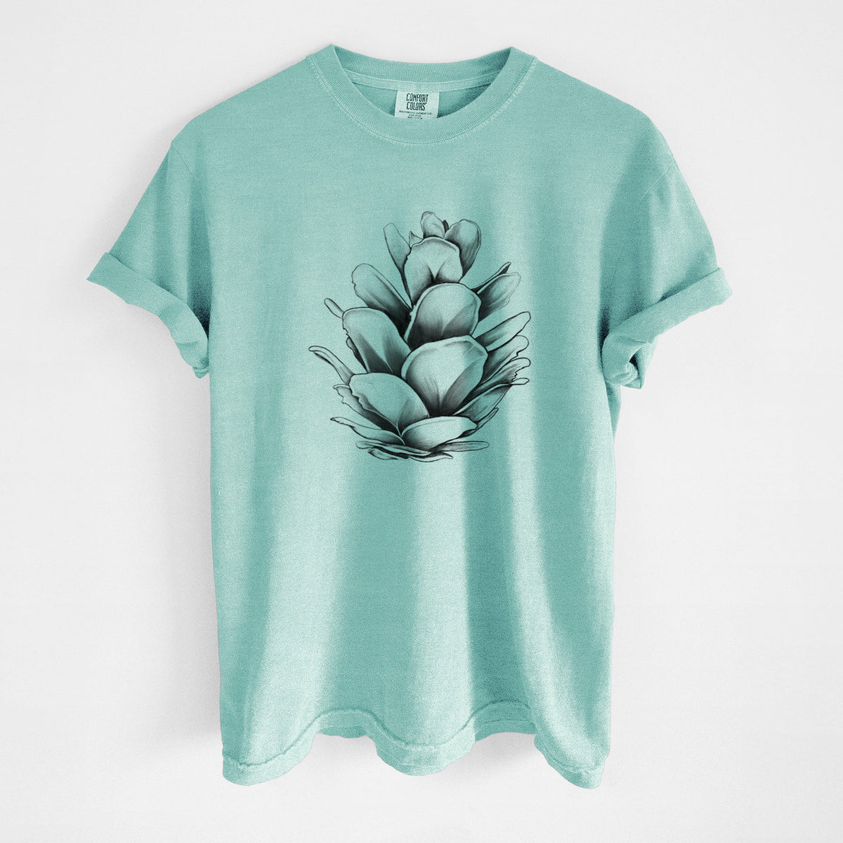 Chalky mint Comfort Colors t-shirt laid flat, printed with a detailed black ink illustration of a western hemlock pine cone.