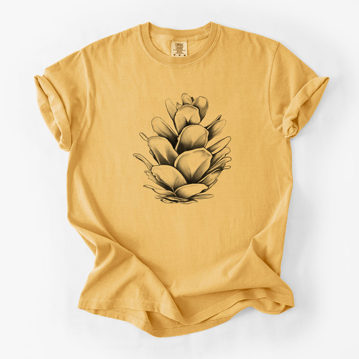 Golden wheat yellow Comfort Colors t-shirt laid flat, printed with a detailed black ink illustration of a western hemlock pine cone.
