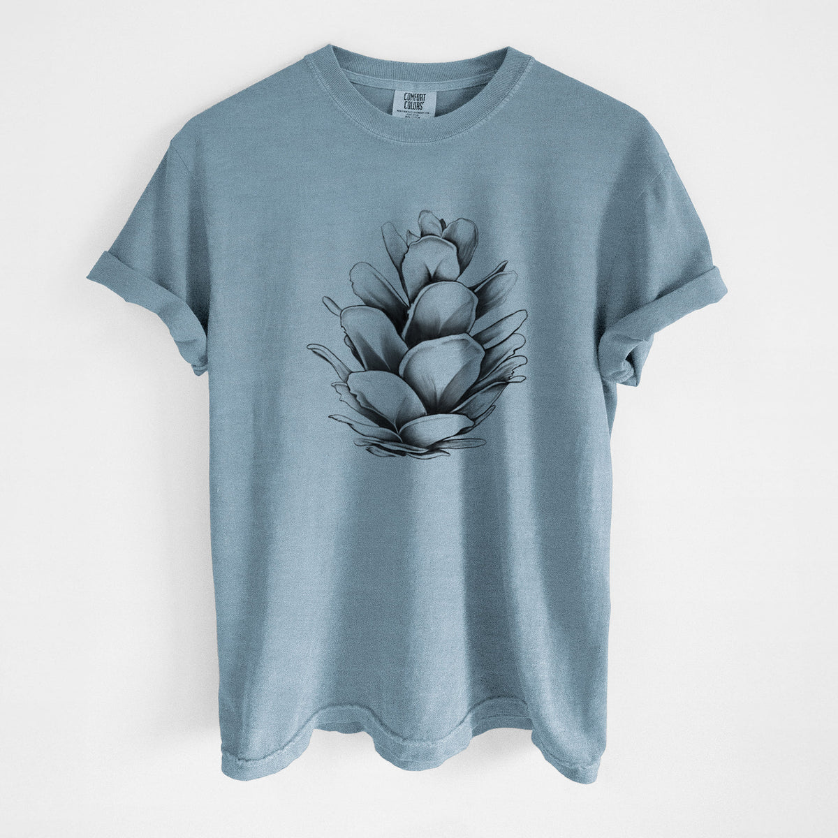 Steel blue Comfort Colors t-shirt laid flat, printed with a detailed black ink illustration of a western hemlock pine cone.