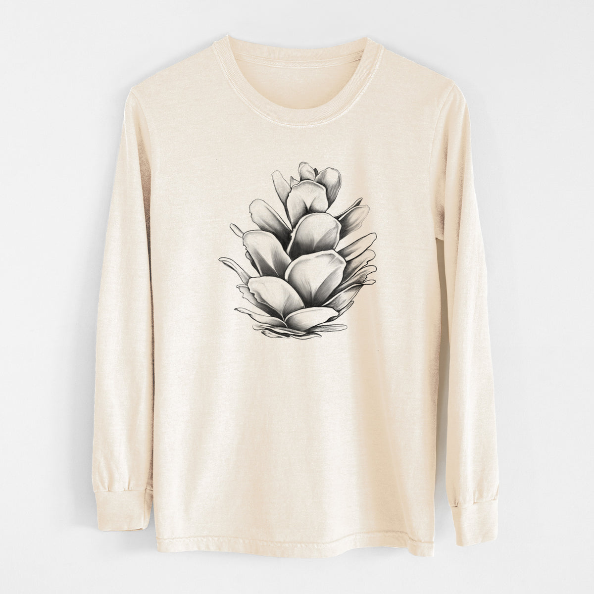 Ivory Comfort Colors long sleeve shirt laid flat, printed with a detailed black ink illustration of a western hemlock pine cone.